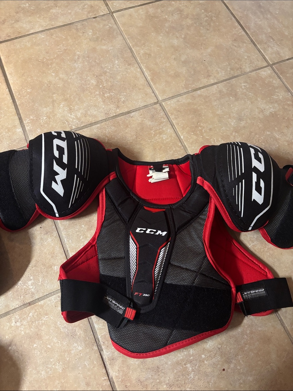 CCM Black and Red Hockey Shoulder Pads